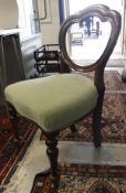 A set of four Victorian mahogany balloon back dinning chairs with upholstered seats on baluster