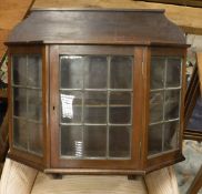 An Edwardian mahogany and leaded glazed wall cabinet