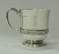 A George VI silver Christening mug in the Gothic Revival taste with Celtic style banded decoration