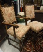 A set of eight early to mid 20th Century oak framed dining chairs in the 17th century style with