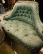 A late Victorian buttoned upholstered canape on cabriole front legs to scroll feet