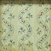 A framed Georgian fabric section the cotton ground with embroidered floral decoration housed in a