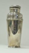 A mid 20th Century silver plated cocktail shaker retailed by Harrods, London and No'd.