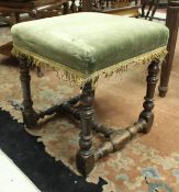 An 18th Century walnut framed stool,