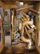 A collection of woodworking tools including plough plane, inscribed "J Thomas",
