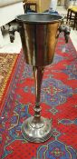 A cast metal floor-standing champagne bucket