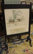 A circa 1900 ebonised framed fire screen decorated with hand coloured Chinese engraved plate,