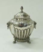 A silver tea caddy in the Classical style with lion mask ring handles (marks rubbed), 6.