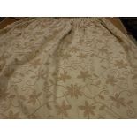 A pair of cotton type cream ground crewel work style decorated interlined curtains with tape,