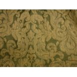 A pair of cotton green and gold foliate decorated curtains, interlined,