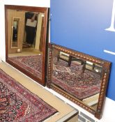 A large mahogany framed mirror with bevelled glass together with a carved bobbin oak framed mirror