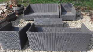 A Lloyd Loom garden suite comprising two three seat sofas,