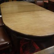 A Victorian mahogany D-end dining table with extra leaf on cabriole legs to claw and ball feet