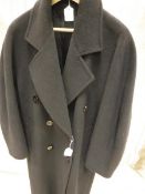 A ladies black wool coat bearing Harrods retail label