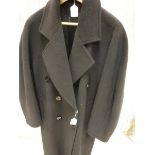 A ladies black wool coat bearing Harrods retail label