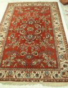 A modern machine woven rug of Persian style,