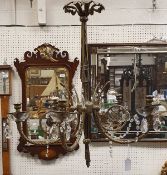 A brass framed and glass drop five branch electrolier in the 19th Century manner
