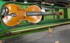 Three various cased violins, one bearing "Stradovarius" label,