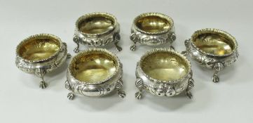 A set of six Victorian silver cauldron salts with gilt-washed interiors,
