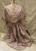 A Victorian half mourning silk day outfit comprising top and skirt in lilac strip