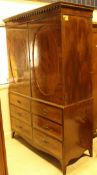 A 19th Century mahogany linen press with two cupboard doors over two banks of three drawers