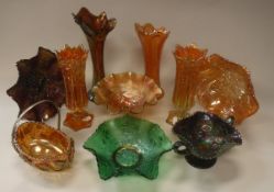 A large collection of carnival glass to include bowls, vases, cups,