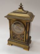 A late Victorian brass cased mantel clock the eight day movement by Japy Freres of Paris the