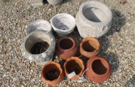A collection of 9 various terracotta and composite stone garden pots/urns