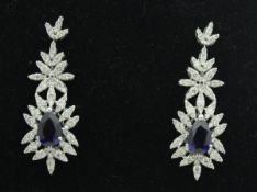 A pair of 18 carat white gold sapphire and diamond set earrings,