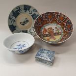 A collection of Oriental design pottery and porcelain to include three bowls,