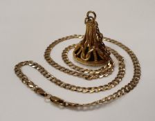 A Victorian gold watch fob set with hard stone with warrior's head sat on a 9 carat gold flat link