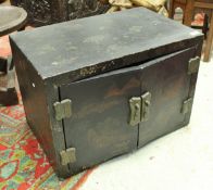 An early 20th Century black lacquered and chinoiserie decorated two door cabinet