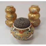 A pair of Japanese Meiji period Satsuma ware gourd shaped miniature vases together with a similar