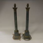 A pair of simulated lapis lazuli and brass mounted corinthian column table lamps