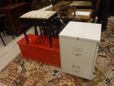 A modern cream two drawer filing cabinet, a red painted wooden trunk,