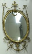 A circa 1900 giltwood and gesso framed wall mirror with urn and swag decoration in the Adam taste
