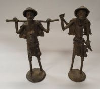 A pair of sandcast bronze figures of Fulani pastoralists (traded with village headmen in the