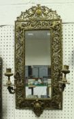 A late Victorian giltwood and gesso framed girandole mirror with milk glass panels and central