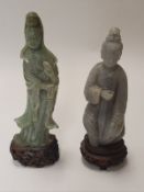 A 20th Century Chinese jadite figure of Guan Yin and a grey speckled hardstone carved figure of a