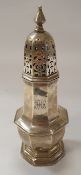 A late Victorian silver sugar caster of typical octagonal lantern form,