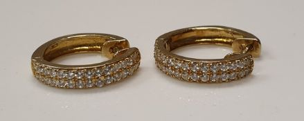 A pair of 9 carat gold and diamond set hoop earrings