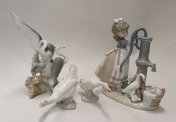 A Lladro figure group "Girl at the Pump" with geese and goslings, Lladro figure of two cranes,