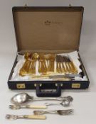 A Bestecke Solingen gold plated canteen of cutlery housed in leatherette case together with a