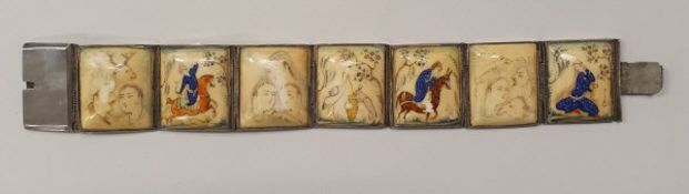 An early 20th Century hand painted Persian bracelet made up of seven bone tiles each depicting