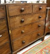 An early 19th Century mahogany chest of two short over three long drawers