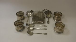 A collection of silver to include a set of four silver knapkin rings by William Comyns,