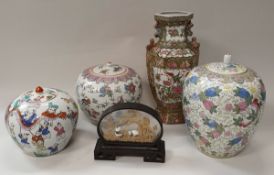A pair of Chinese ginger jars with polychrome decoration depicting figures in a landscape,