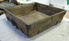 A 20th Century iron bound stained pine trough of rectangular form with wrought iron handles