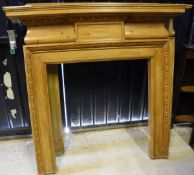 Two stained pine fire surrounds,
