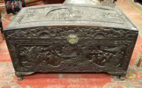 An Eastern carved camphor wood trunk,